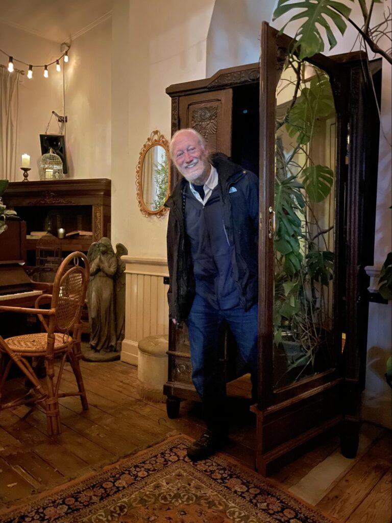 Dick (finally) coming out of the closet. The entrance to the bar/restaurant we found, Paco Caio, was through an armoire found in a small room at the entrance to a building.