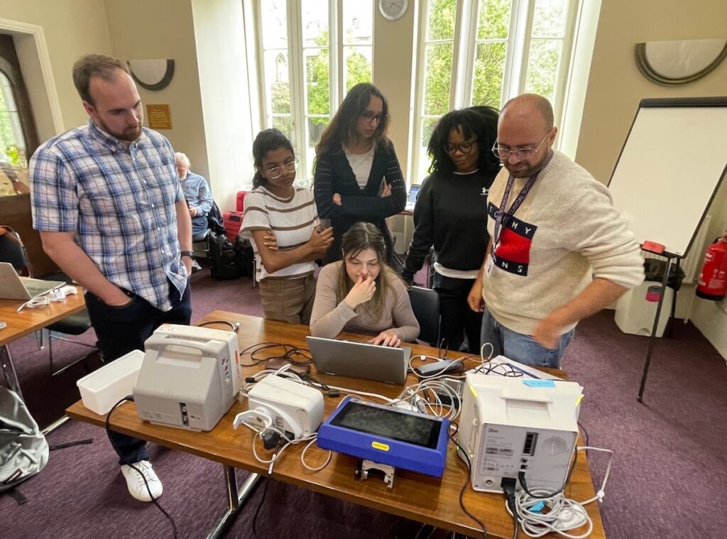 A small group engages in hands-on exercises to learn about device connectivity.